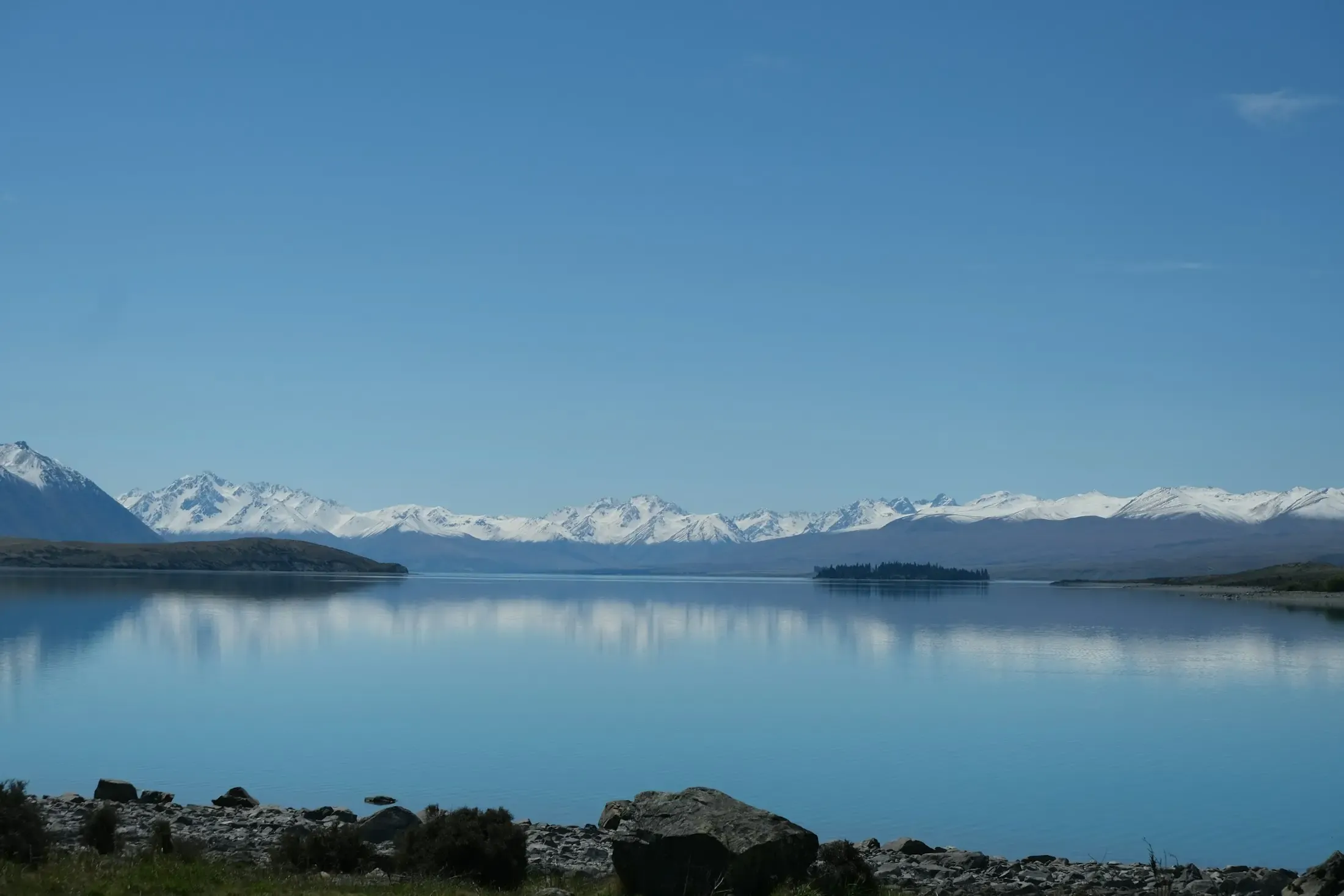 Lake Pukaki with the snow-capped Southern Alps behind it